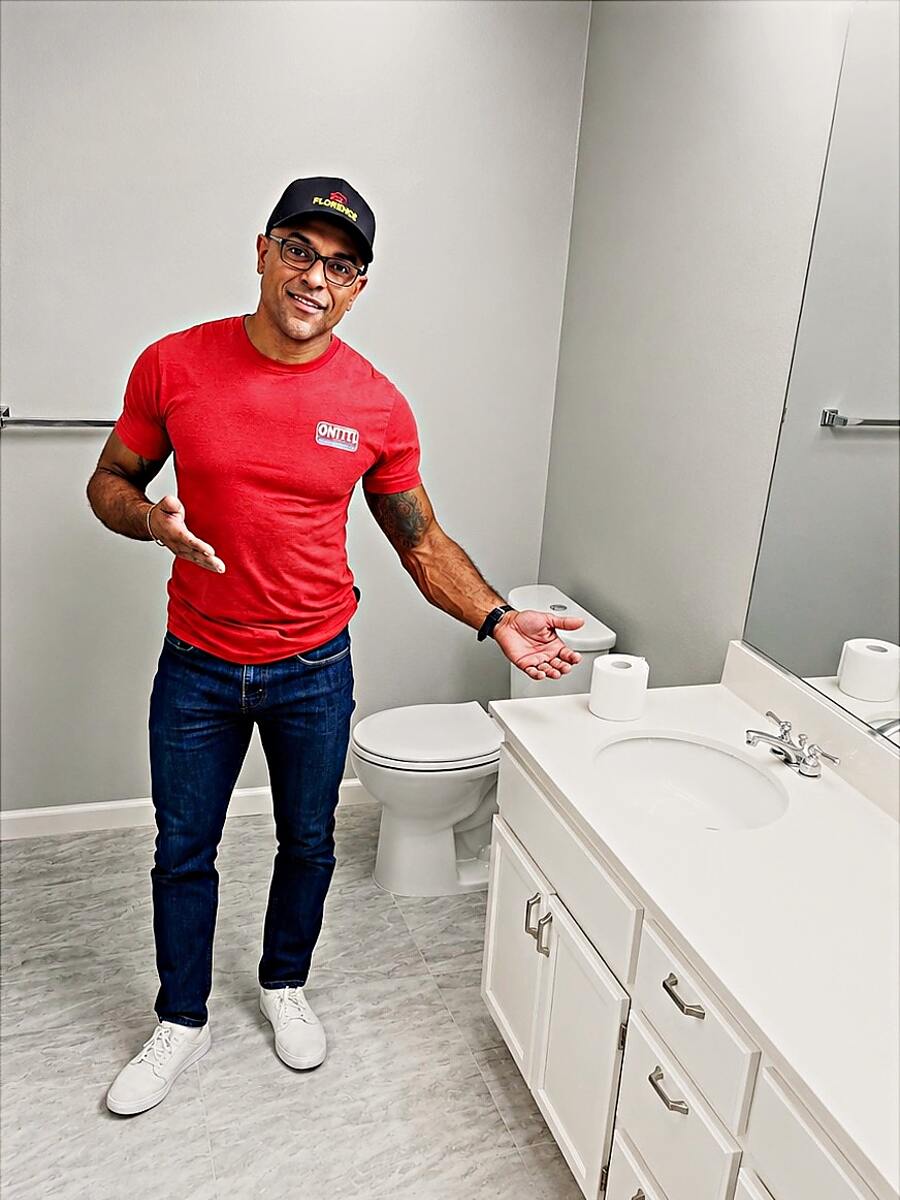 Junior, owner of Junior Elite Services, in a bathroom his crew just finished